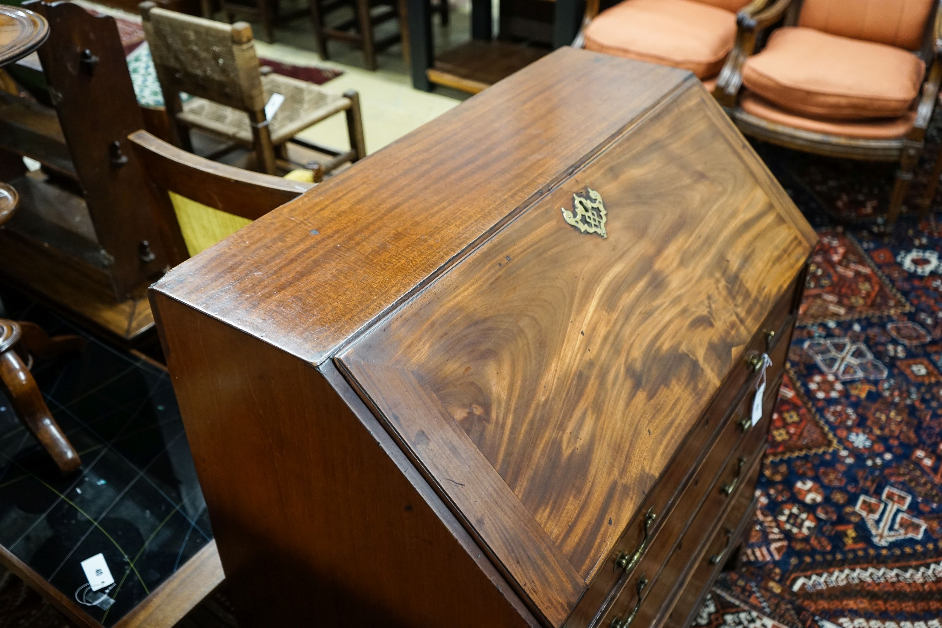 A George III mahogany bureau, with fall front and four drawers, width 91cm, depth 50cm, height 102cm